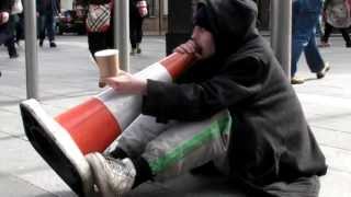 Street Musician Playing a Traffic Cone. London
