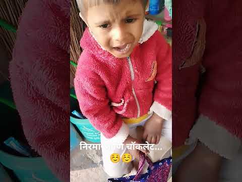 small boy buying Nirma and chocolate in general store....