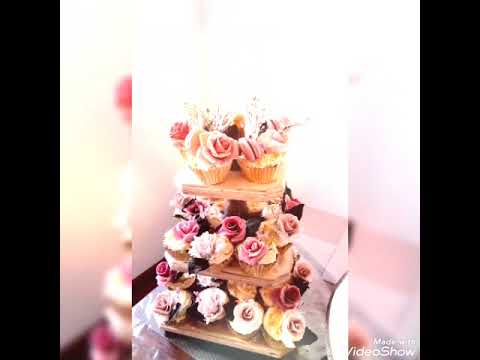 engagement cake with lovely sugar flowers with cup cakes and Meringue tower