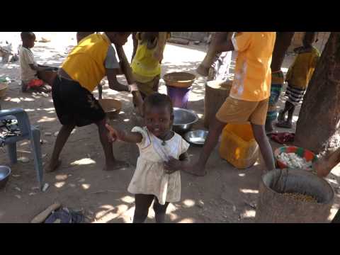 Crushing maize and millet in a small village in Burkina Faso