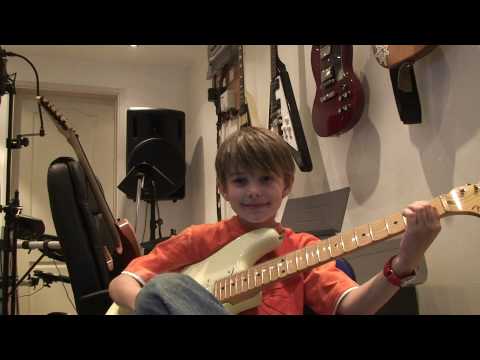 Harry at age 8 after playing guitar a few weeks, having fun. Rock and Roll!