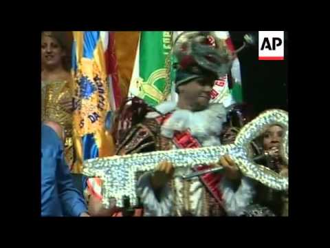 Carnival King Momo on parade, receives key to the city