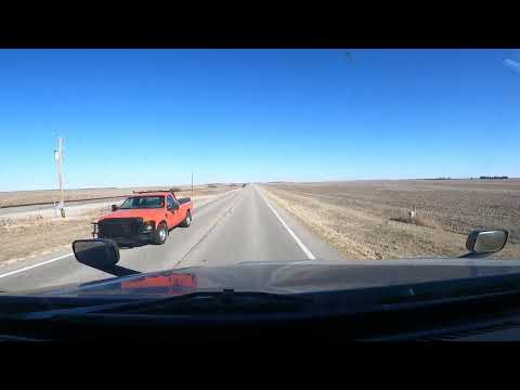 Far from the Interstate.  Passing a train in Rural Kansas.  KS 61 near Turon, KS