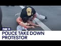 Police take down protestor approaching POTUS motorcade at Summit of the Americas