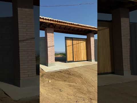 Portão de chácara,automatizado feito com ferro e madeira