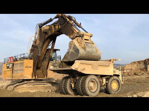 Huge Caterpillar 6040 Excavator Loading Terex TR100 And Hitachi Dumpers