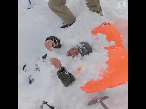 Snowboarders rescue two people buried in avalanche | ABC News