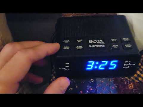 Part of a video titled HOW TO CHANGE THE TIME ON A DIGITAL ALARM CLOCK - YouTube