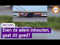 Gaat dit schip zonder schade onder deze brug doorkomen?