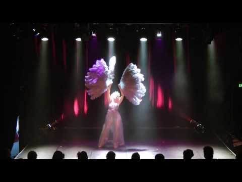 The Diamond Dahlia performs Burlesque Act with feather fans "Starlight"