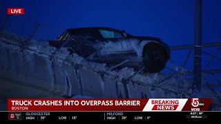 Truck left partially dangling over Interstate 93 overpass in Boston after crash
