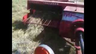 preview picture of video 'Baling Hay with the MF 135 and MF 124 Hay Baler (2012)'