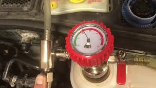 Using vacuum tool to fill a cooling system