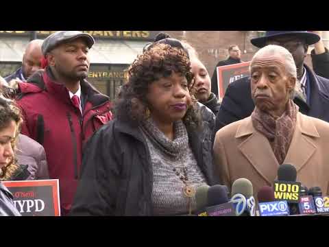 A New York City police officer accused in the death of an unarmed black man will face a disciplinary hearing in May. The family of Eric Garner appeared outside police headquarters following Thursday's hearing. (Dec. 6)