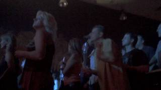 A guy at slobberbone dancing and hitting on women