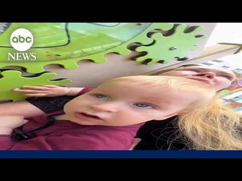 Woman shields toddler during Russian drone attack on Kyiv
