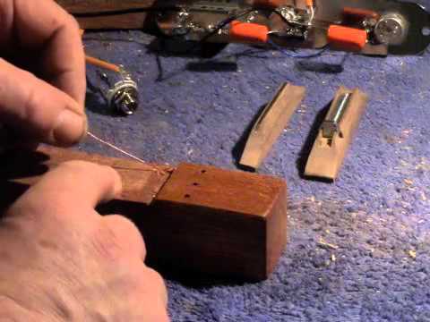 How to earth (ground) the strings on a cigar box guitar.