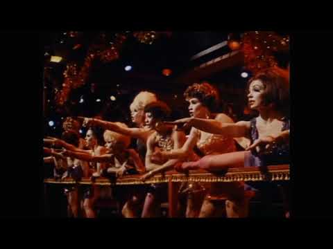 Sweet Charity trailer still — neon-lit 1960s glamour framing Charity’s world