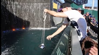 Scooping baseballs from the fountain at Kauffman Stadium