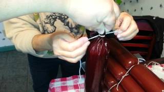 How to stuff a summer sausage and tie it off.