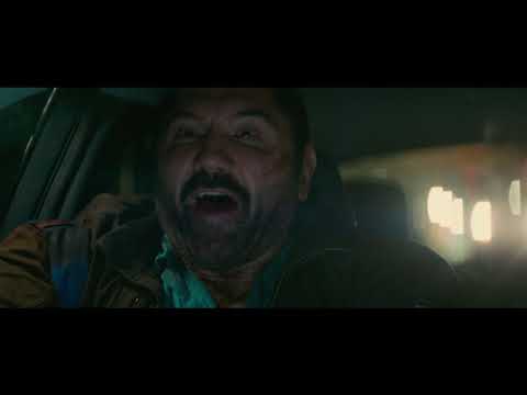 Stuber trailer still — Stu and Vic in a spinning Uber as chaos starts