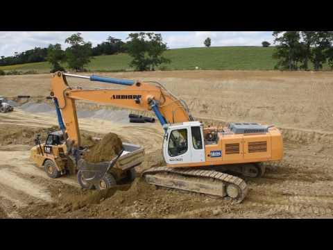 Liebherr R954C loading Caterpillar 730 (with nice horn)
