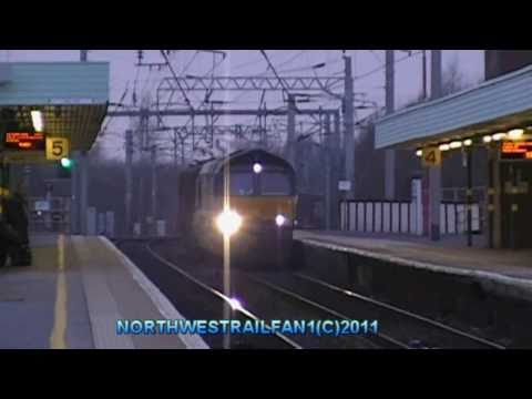 Colas class 66843 on the (6j37) log train @ wigan north western on the 15/03/2011