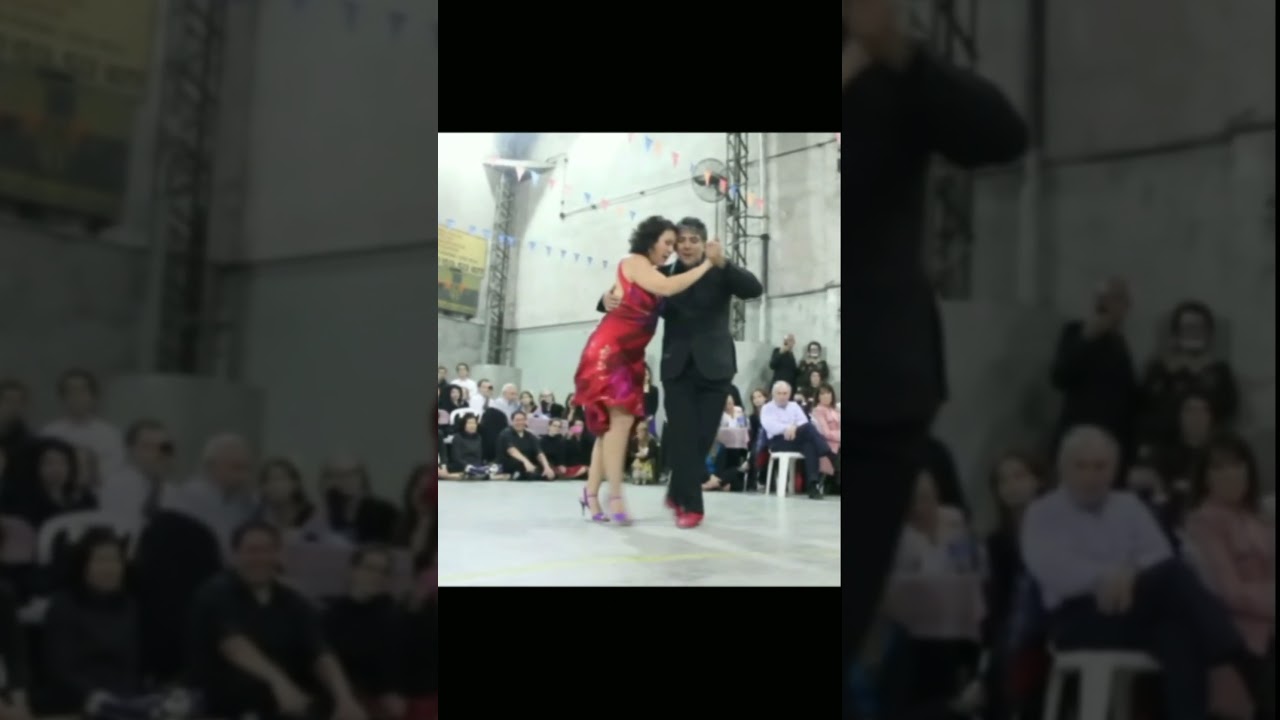 Featured artists JULIO BALMACEDA and CORINA DE LA ROSA dancing milonga