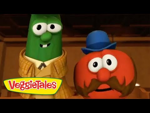 Green cucumber character in a tan plaid suit stands next to a red tomato character with a blue hat and big mustache; VeggieTales logo in the corner.