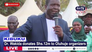Dr.Wakida Contributes 12 million shillings towards Oluhuje Organizers and Banyole SACCO 