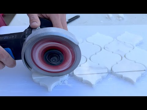 Part of a video titled How To Cut Marble With An Angle Grinder - YouTube