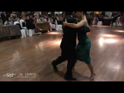  Raymond Chu  and  Lily Cheng  are  dancing  to  the  tango  "  El ultimo café  "  at  Singapore International Tango Festival  in  2018