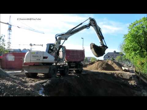 Bagger TEREX ATLAS TW 1305 belädt einen Laster - Soeren66