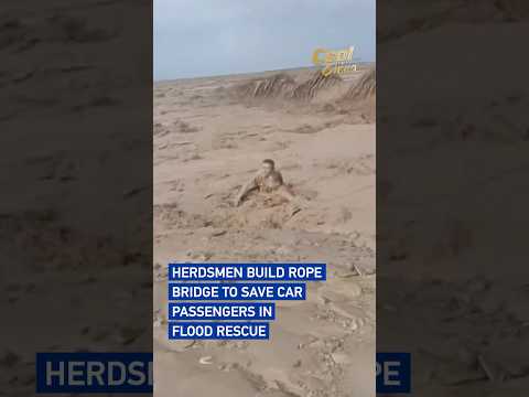 Herdsmen build rope bridge to save car passengers in flood rescue