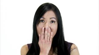 Close up shot of a woman with a surprised look on her face.