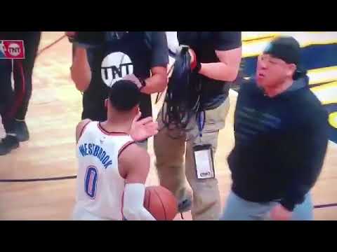 Russell Westbrook pushes a Nuggets fan that somehow got on the court after Gary Harris buzzer beater