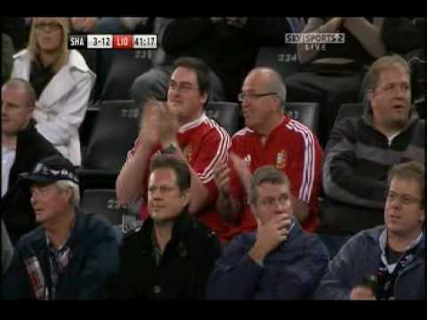 Mike Phillips blasts through the Sharks