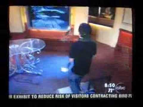 A kid juggling with fire and playing DDR on news
