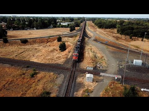 (4K ULTRA HD) Aerial Footage: 3 Freight Trains at Binney Junction Marysville, CA