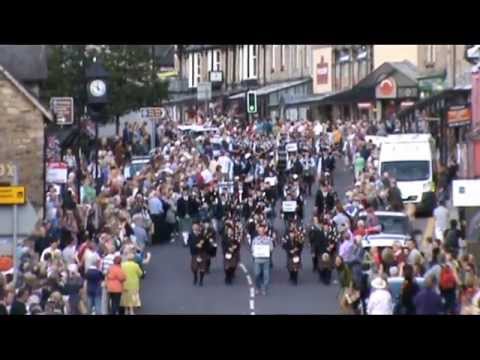 Pitlochry Highland Games Massed Pipe Bands march down Pitlochry main street