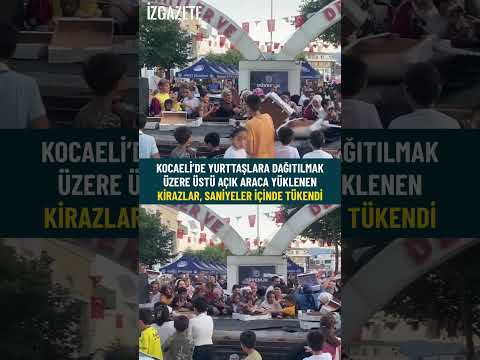 Kocaeli’de yurttaşlara dağıtılmak üzere üstü açık araca yüklenen kirazlar, saniyeler içinde tükendi