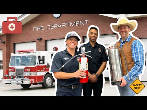 Firefighters and a safety instructor stand with fire extinguishers in front of a fire station.