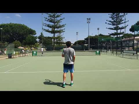 Court level view of Pedro Sousa and João Sousa practicing together in the Summer of 2020