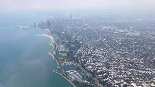 Flying over Chicago downtown and Lake Michigan