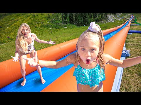 WE TURNED OUR BACKYARD INTO THE WORLD'S LARGEST WATERSLIDE Video