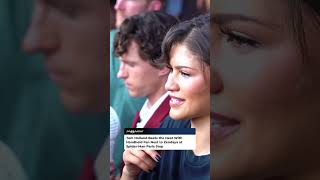 Tom Holland Beats the Heat With Handheld Fan Next to Zendaya at Spider-Man Paris Stop