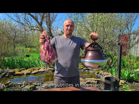 Cooking Uzbek pilaf with lamb in an Afghan cauldron.