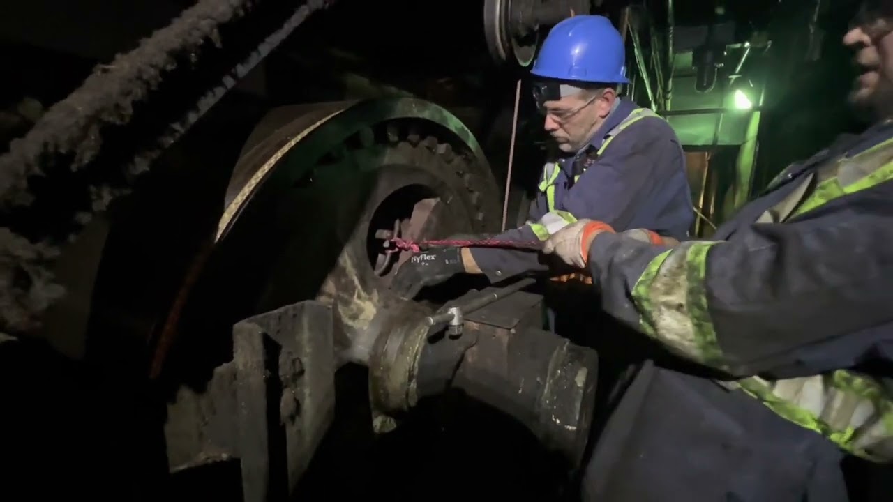 Replacing a man cover on a steam can used in paper making
