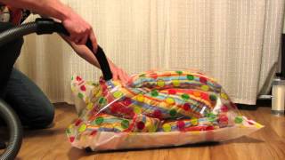 packing an eiderdown (quilt) into vacuum bag using vacuum cleaner [HD]