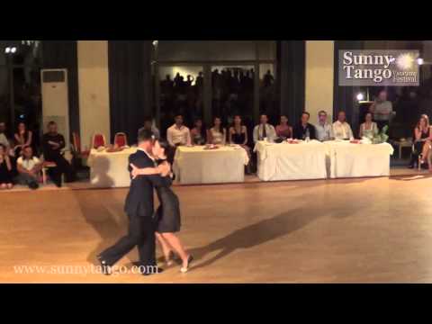  Kostas Nikolaidis  and  Vassia Thanopoulou  are  dancing  to  the  tango  "  Café Domínguez  "  by  Ángel D'Agostino  at  Sunny Tango Festival  in  2013